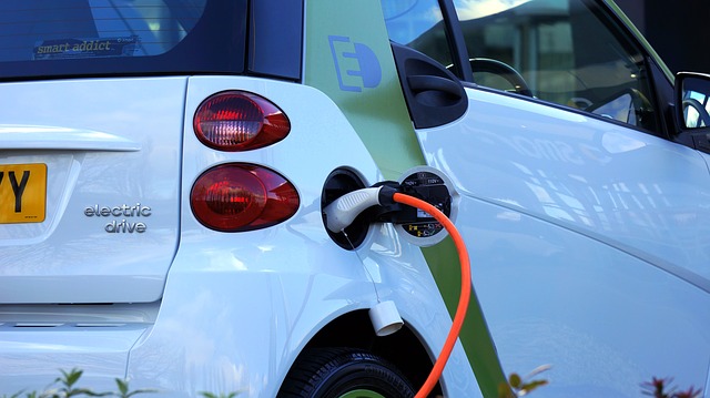 Electric car hooked up to power point
