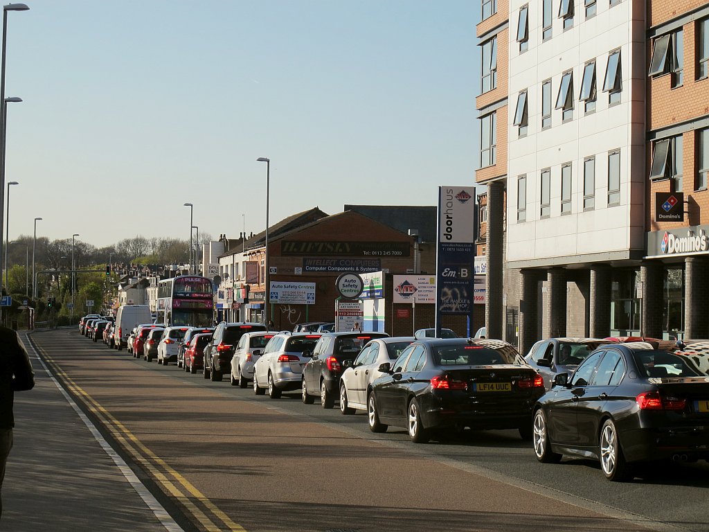 Long line of cars at a stand still on a road in Leeds