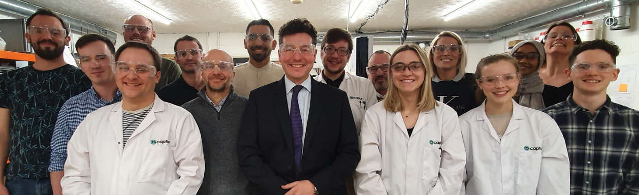 C-Capture team smiling at camera wearing protective glasses