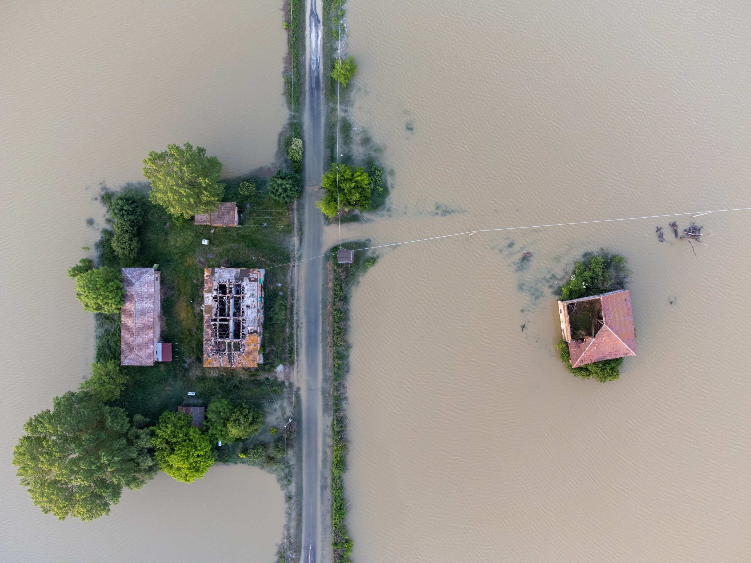 shows fields completed flooded and houses submerged in water